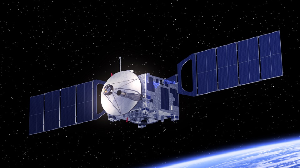 A picture of a satellite in space, covered in solar panels.