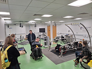 members of activity alliance being shown the equipment in the PHC lab by PHC members
