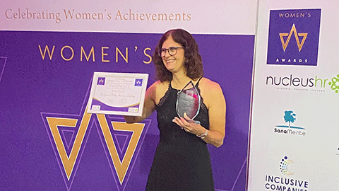 Professor Vicky Goosey-Tolfrey posing with her Woman in STEM 2024 award.