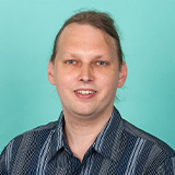 Headshot of Thomas