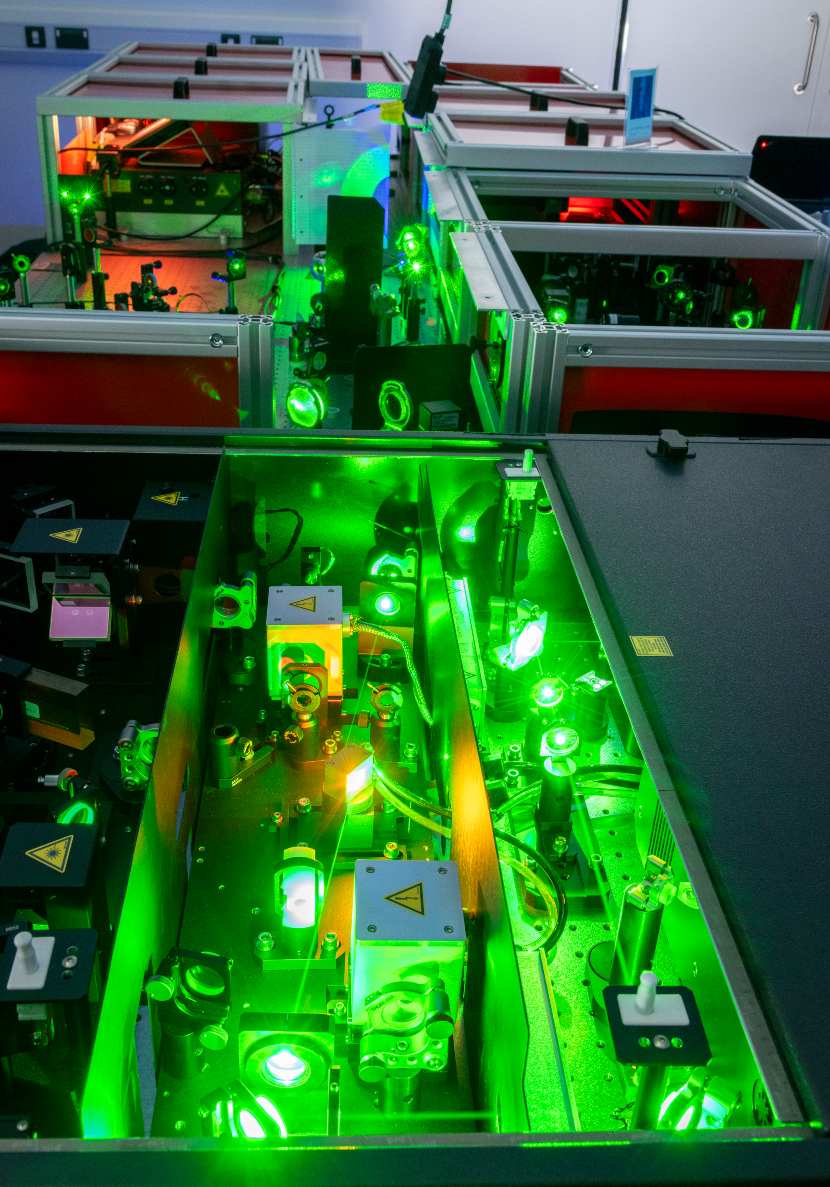 A table of laser lights lighting up in green