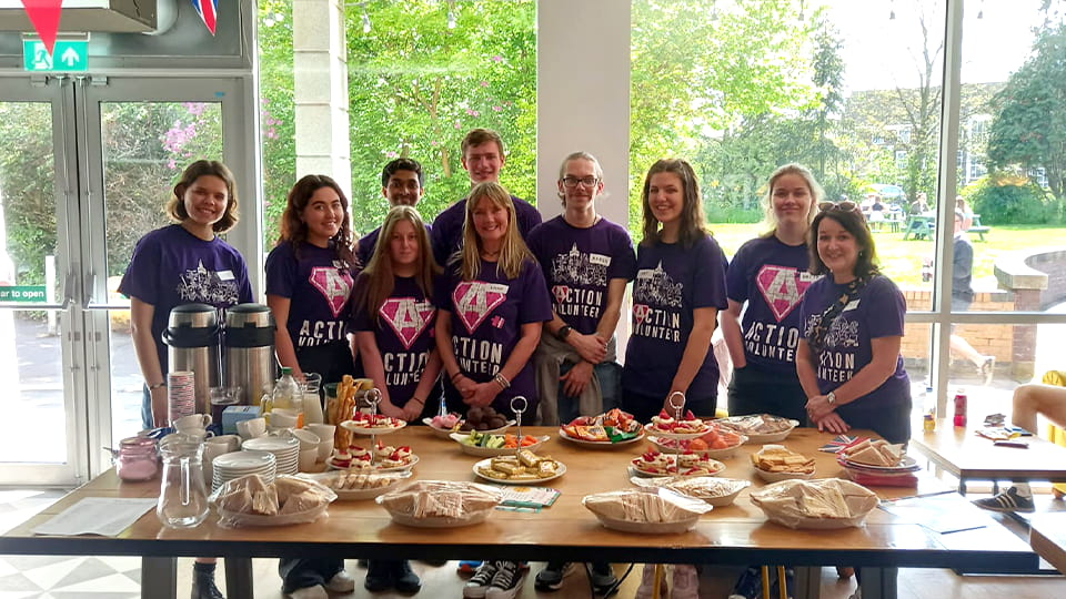 ACTION volunteers helping the local elderly have made a table of food as part of this elderly social event.