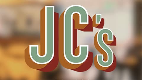 A white JC's logo