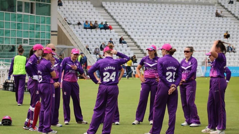 Lightning cricketers standing in a group