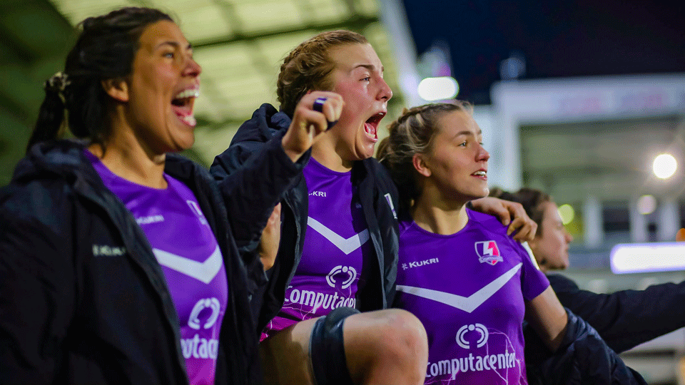 three women in the stands