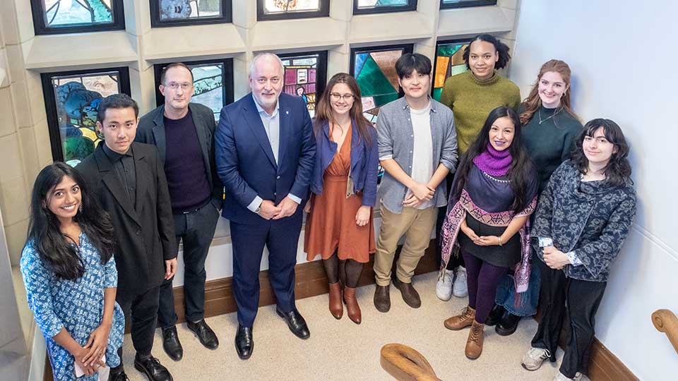 Arts scholars stood with the Vice-Chancellor.