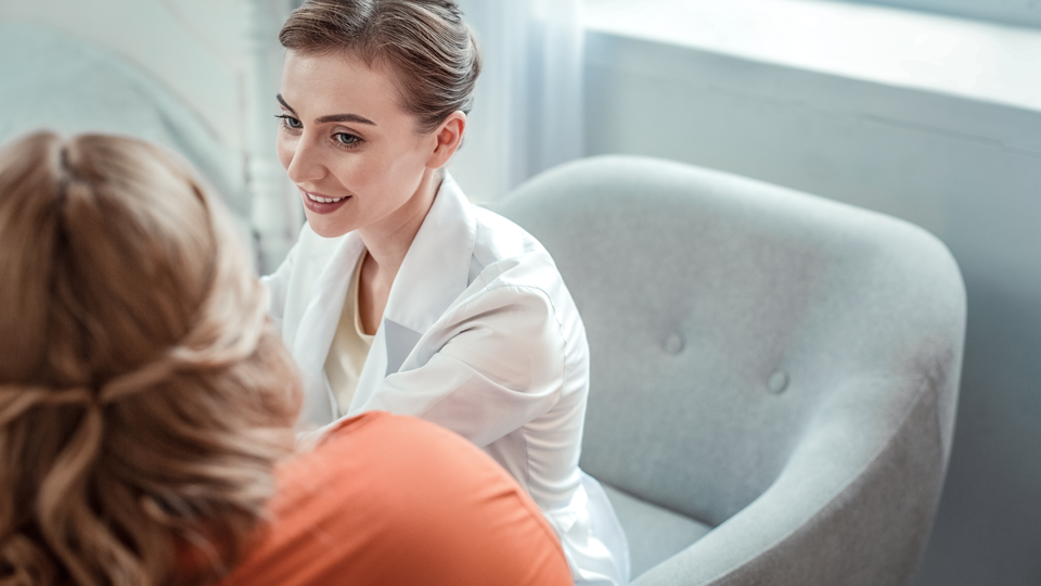 A female therapist talking to a patient off camera