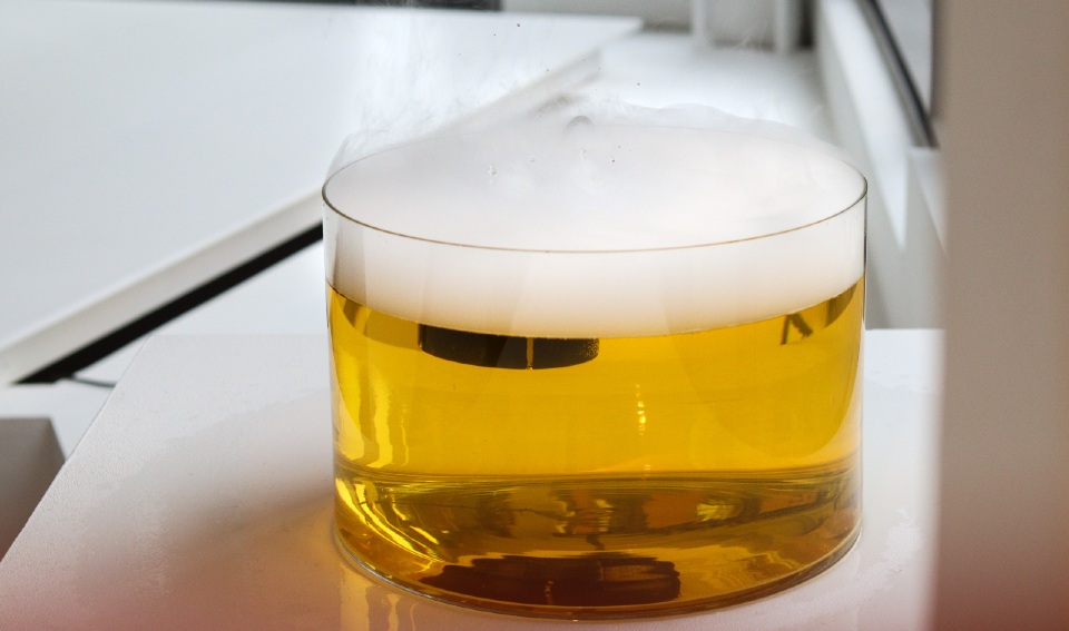 A bowl of yellow steaming liquid. Tale of the frozen bits, installation view. Photo by Beth Clark