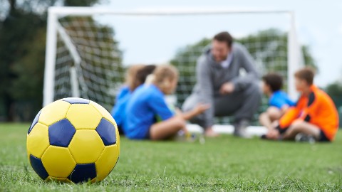 a posed picture of children playing sport