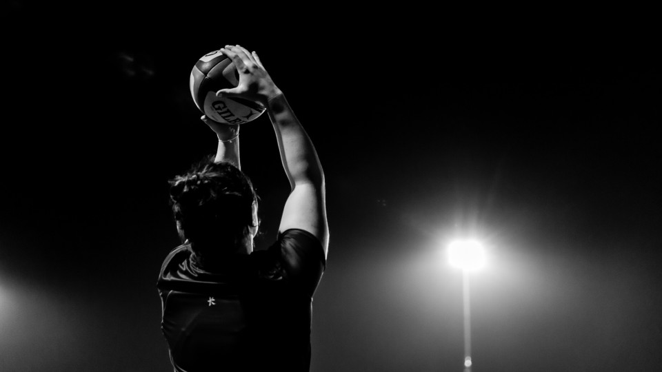 a rugby ball thrown in from the sidelines