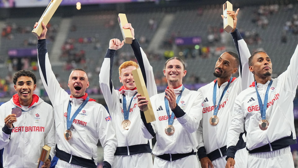 The full GB team celebrate with their 4x400m bronze medals