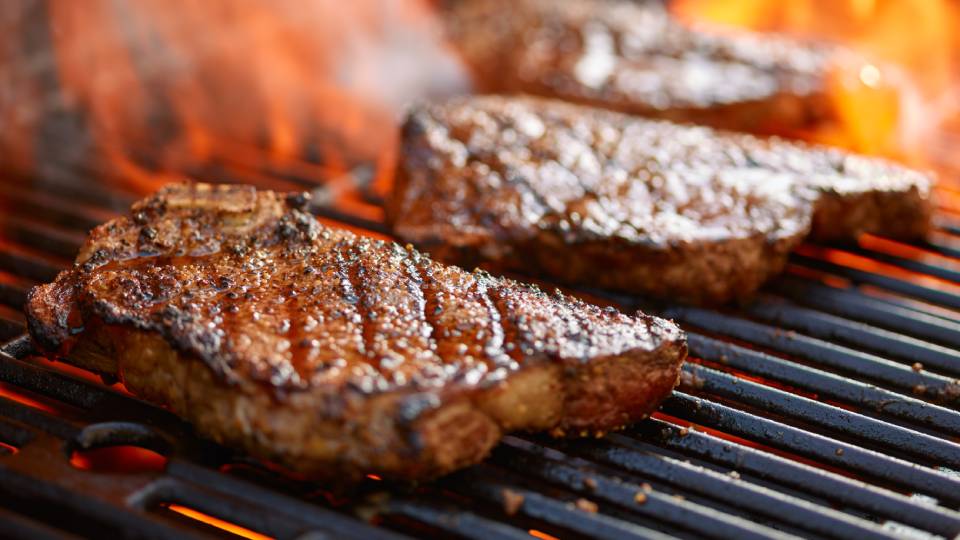 steak cooking on a grill