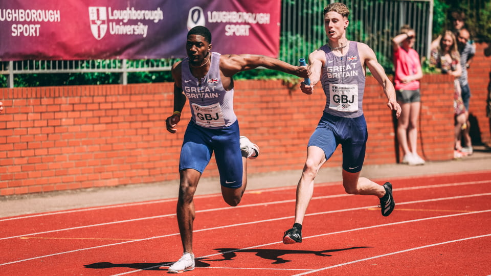 runners passing a baton