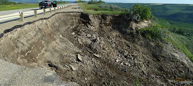 landslides causing significant damage to a road