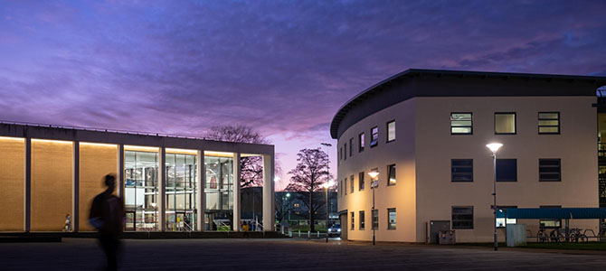 Campus buildings at dusk.