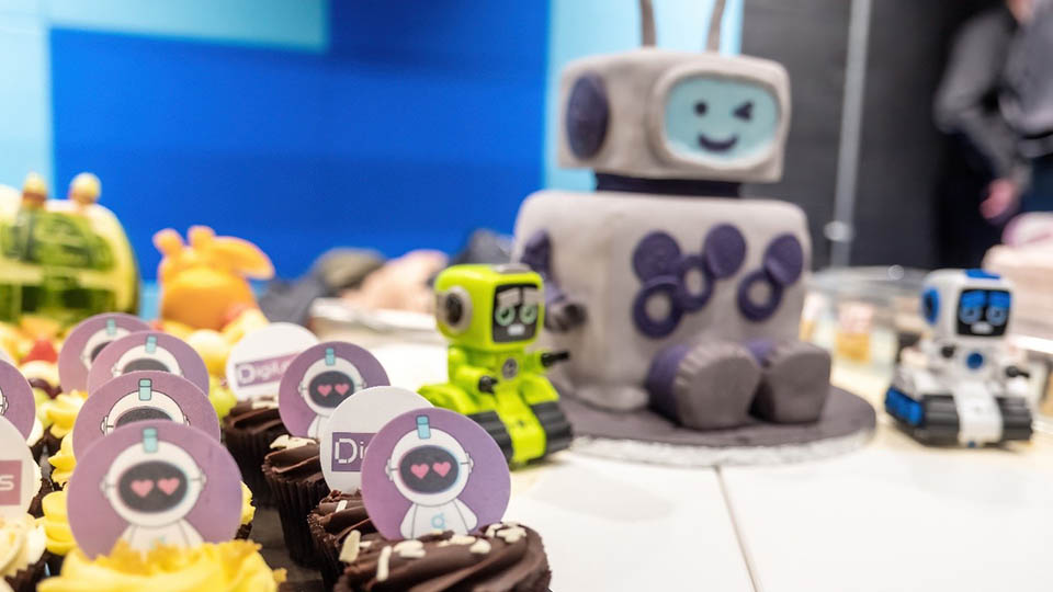 Robot-themed decorated cakes on a table