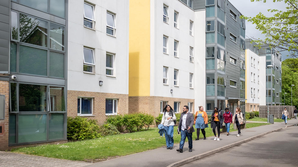 Students walking by John Phillips accommodation